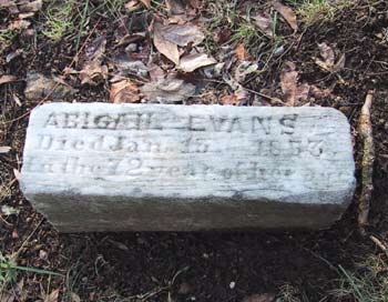 simple stone slab marking the grave of Abigail Evans