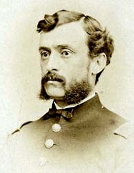 formal head and shoulders three quarters shot, officer in dress uniform, with mustache, bushy sideburns, clean-shaven chin