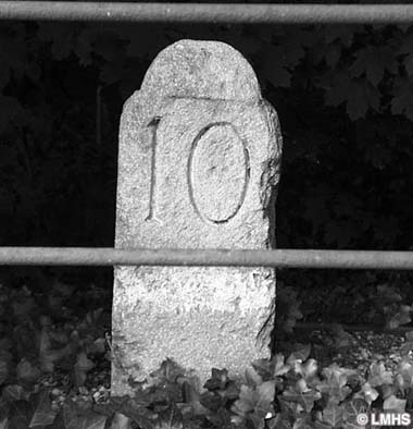 round-top stone carved with number 10