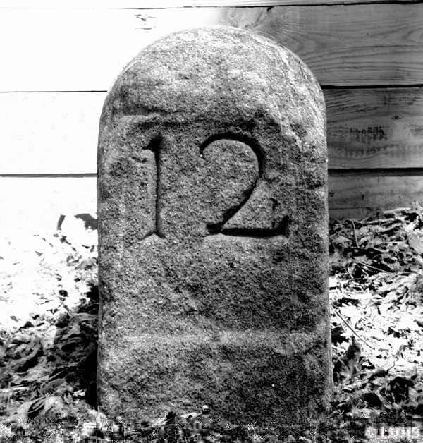 round-top stone carved with number 12