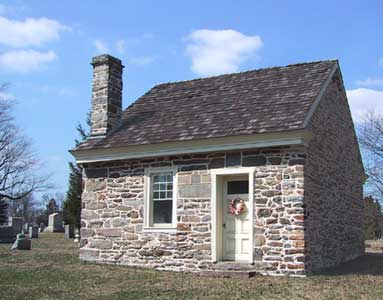small stone house with chimney