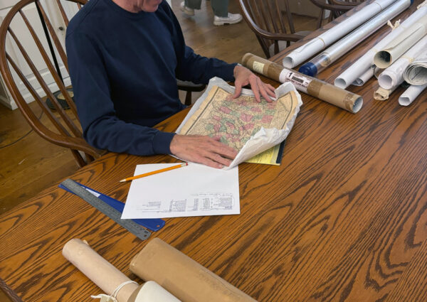 A volunteer reviews maps