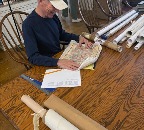A volunteer reviews maps